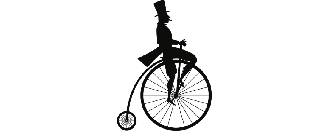 Silouette of man in top hat on old fashioned bicycle