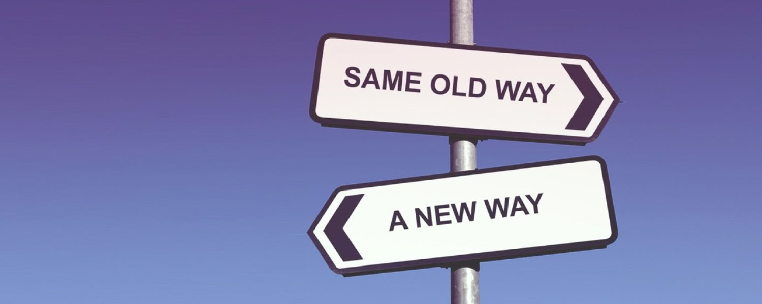 Sign post with 'Same Old Way' and 'A New Way' directions