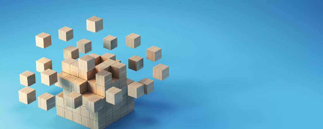 A tower of wooden building blocks with some of the blocks floating above