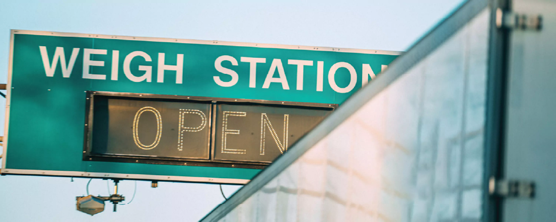 A weigh station sign