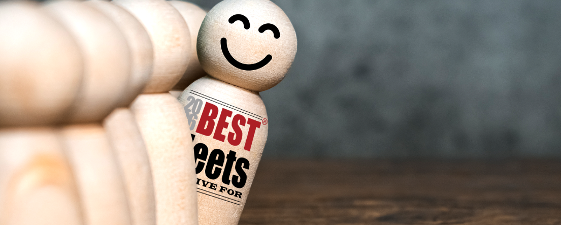 Wooden figures standing in a line with one displaying the Best Fleets to Drive For logo standing out from the rest.